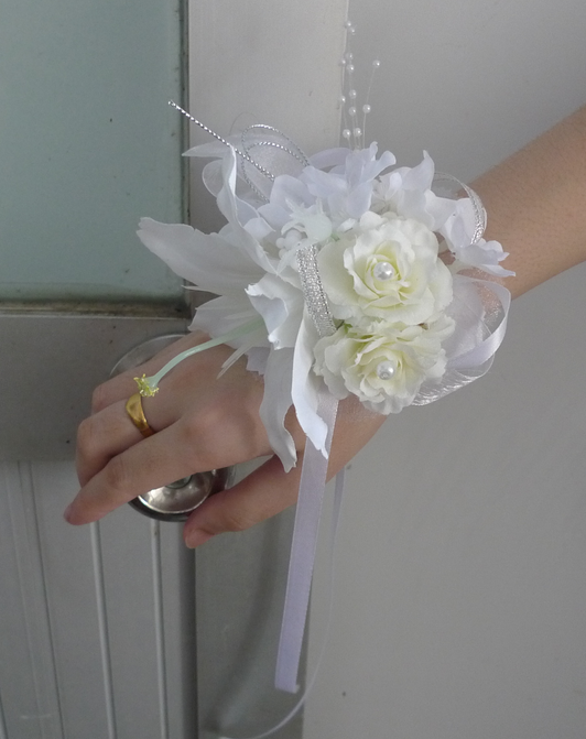 CORSAGES OF SILK WHITE ROSES WITH PEARL BRACELETS